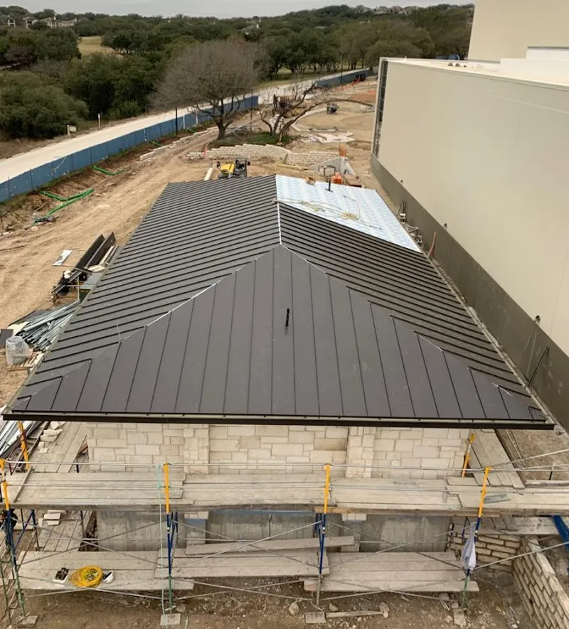 Metal roof new construction with scaffolding in Salida